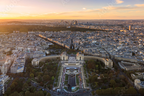 Aerial: Place du Trocadero on the background of the skyscrapers in Paris, sunset, panoramic image
