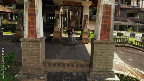 Aerial drone video of young couple in abandoned hotel in Bedugul, Bali island.