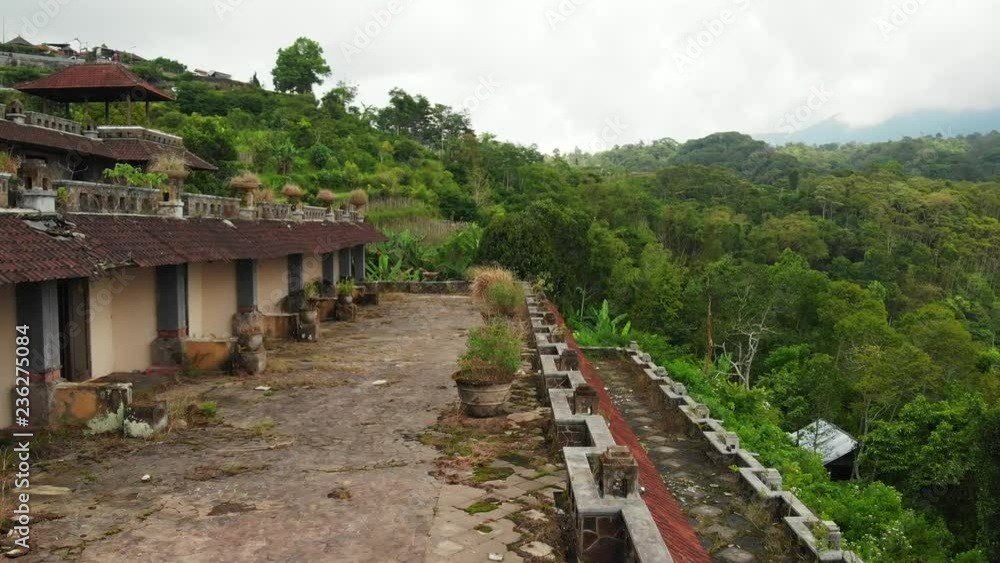 Aerial drone video of woman in abandoned hotel in Bedugul, Bali island. Aerial drone video of woman in abandoned hotel in Bedugul, Bali island.