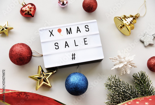 X-MAS SALE text on lightbox composition and Christmas decorations