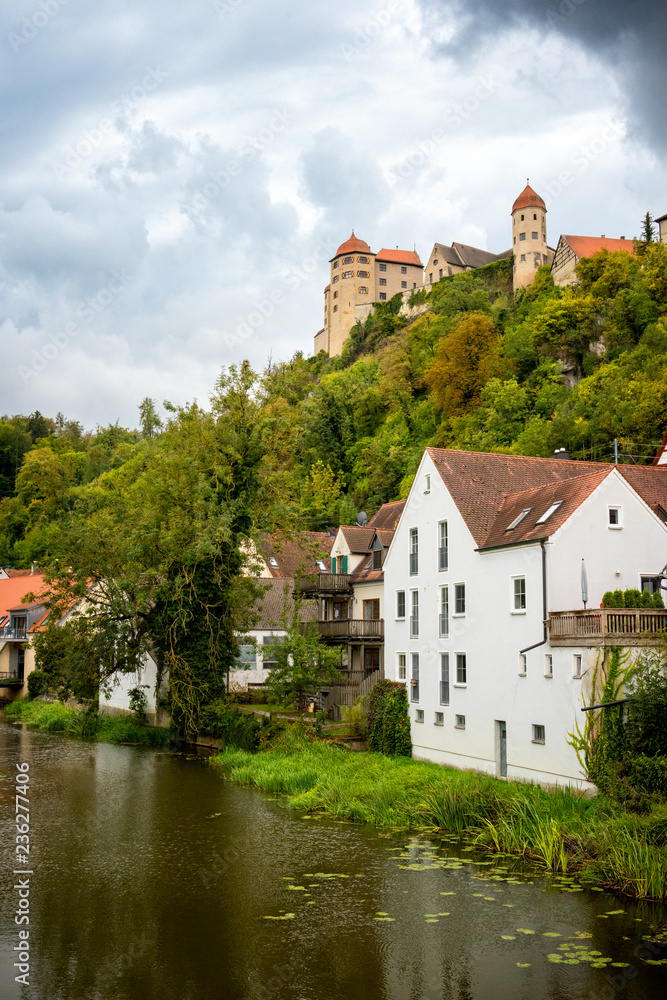 View on the Harburg Castle from the bridge over the river of Wornitz in the city of Harburg in Bavaria, Germany. It is a part of the scenic route called 