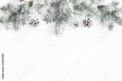 Christmas composition. Border made of fir tree branches  pine cones on white background. Christmas  winter  new year concept. Flat lay  top view  copy space