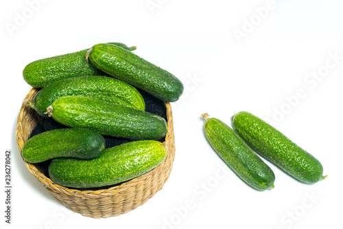Fresh , green cucumbers in box isolated on white background
