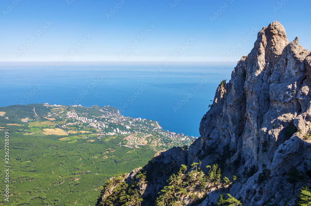 Fototapeta premium Resort town on the seashore. Russia, the Republic of Crimea. 13.06.2018. Town of Gaspra. View from Mount Ai-Petri