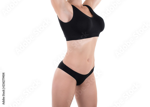 Woman body in black base underwear, isolated on white.