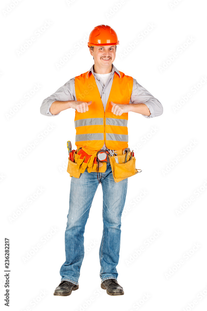 Portrait of a male builder in a helmet looking at camera over white wall background. repair, construction, building, people and maintenance concept. Portrait of a male builder in a helmet looking at camera over white wall background. repair, construction, building, people and maintenance concept.