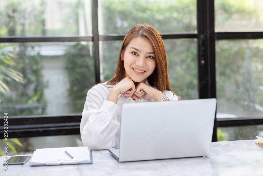 Beautiful Attractive Asian woman working with computer laptop and thinking to get ideas and requirement in Business startup feeling so happiness,Business Startup Concept