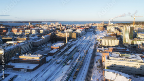 Aerial view of the railway station at sunset. Tampere city in winter.