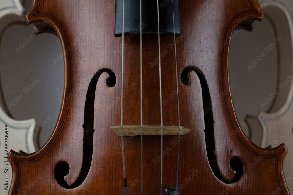 In selective focus of wooden violin,show texture of wood and detail of violin In selective focus of wooden violin,show texture of wood and detail of violin