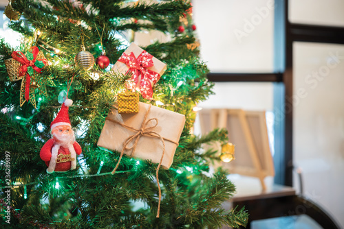 Beautiful home decorated christmas tree with Sata,baubles and gift boxes,Christmas background photo