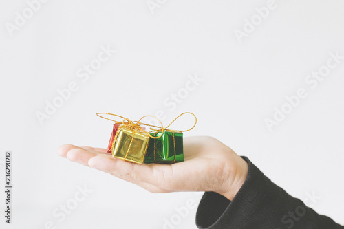 Woman's hands hold christmas gift boxes with copy space.