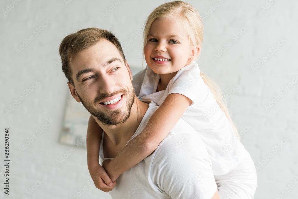 happy father and adorable little daughter hugging and having fun at home happy father and adorable little daughter hugging and having fun at home