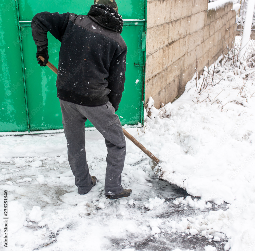 The man was shoveling snow in the winter The man was shoveling snow in the winter