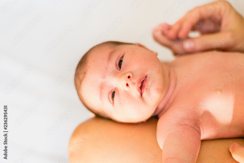 Face portrait of a newborn baby, calm and relaxed. Face portrait of a newborn baby, calm and relaxed.