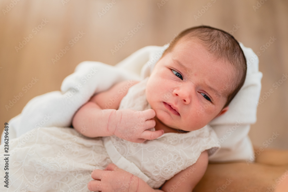 Newborn girl in loving arms of her mother Newborn girl in loving arms of her mother