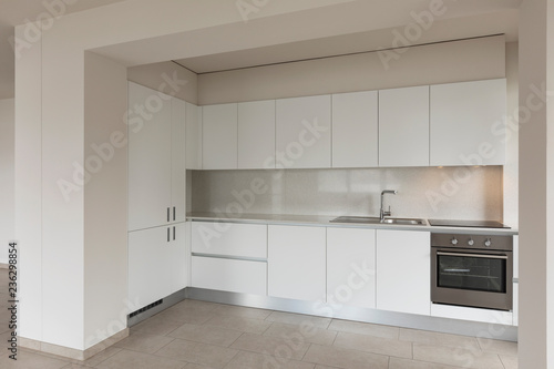 Modern kitchen in empty apartment