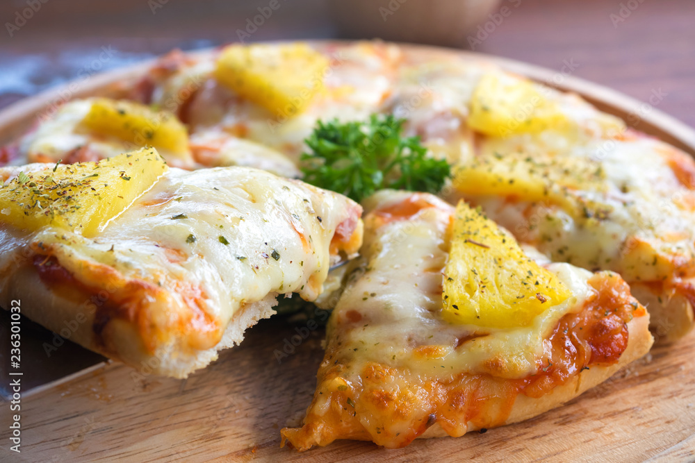 close up of Hawaiian pizza juicy pineapple chunks ham bits melted mozzarella cheese close up of Hawaiian pizza juicy pineapple chunks ham bits melted mozzarella cheese