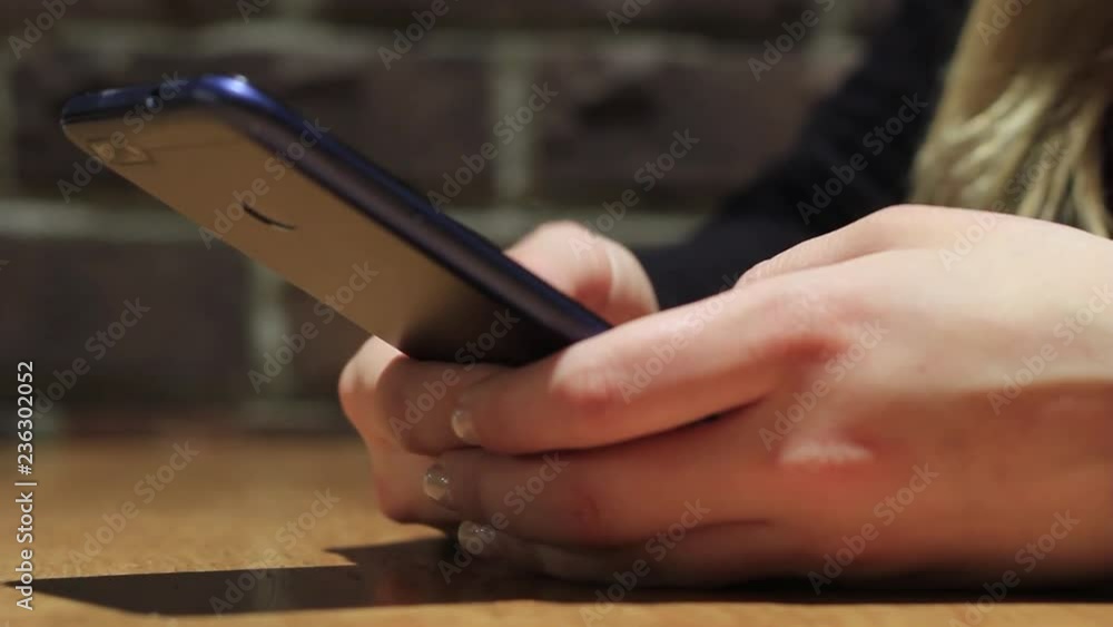 hand holding using mobile phone.girl using smart phone. hand holding using mobile phone.girl using smart phone.