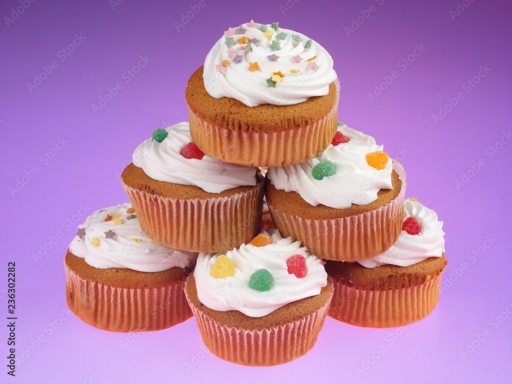 STACK OF FROSTED CUPCAKES OR MUFFINS