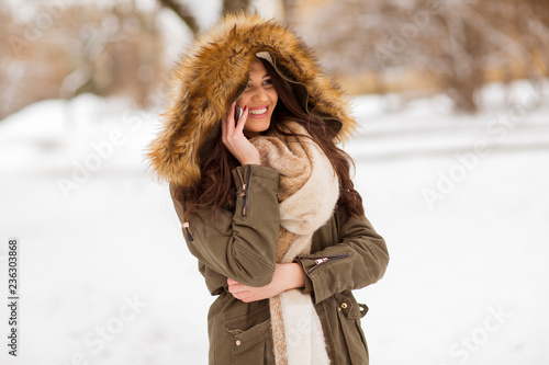 Smiling young woman with ce...