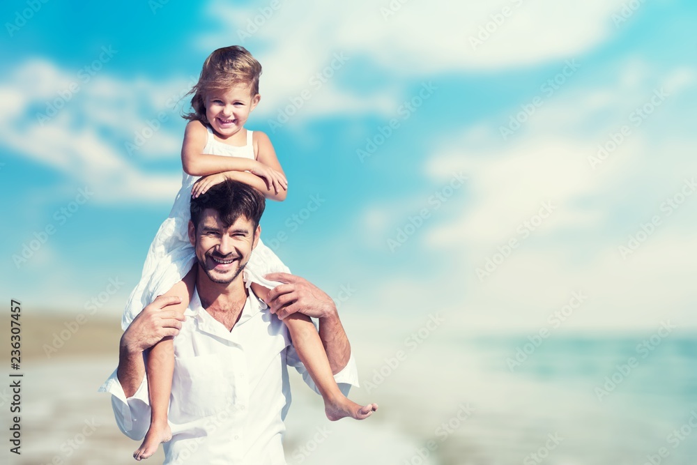 Father with daughter on piggyback over sky background Father with daughter on piggyback over sky background