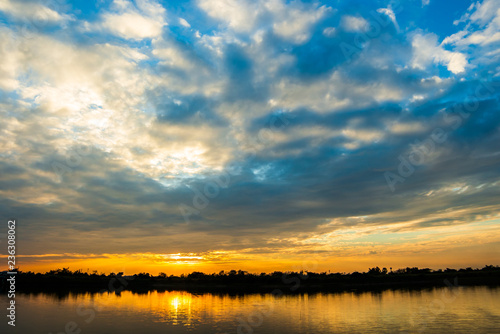 colorful dramatic sky with cloud at sunset.