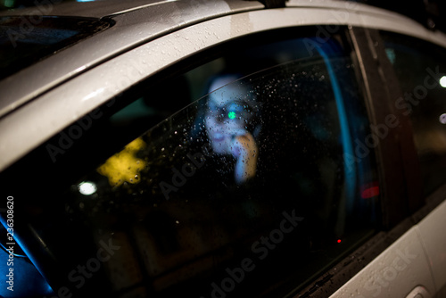 Woman in the car used smartphone