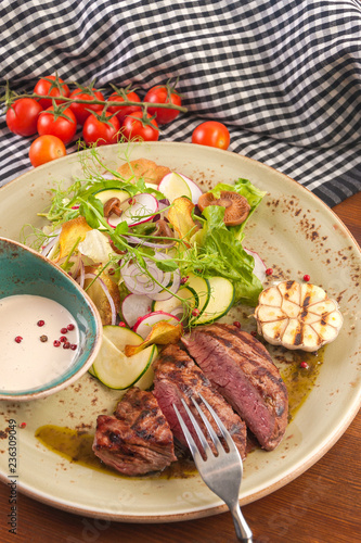 beef chop with salad of vegetables and mushrooms