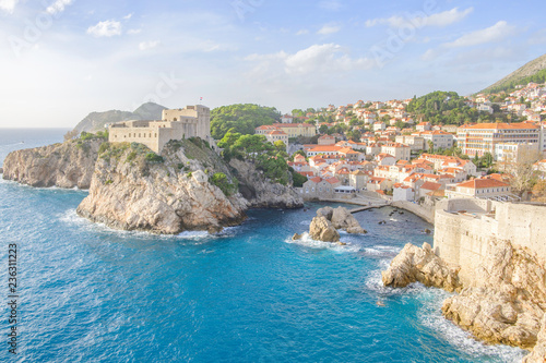 Fototapeta Naklejka Na Ścianę i Meble -  Scenic view of Fort Lovrijenac in ancient touristic town Dubrovnik in Croatia. Beautiful aerial view of fortress on cliff in sunset light in old european resort on Adriatic sea.