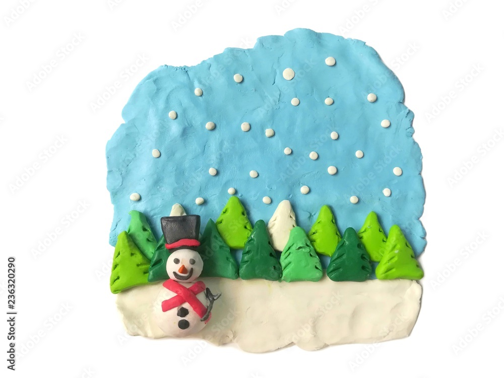Fototapeta Cute smiley snowman and tree made from plasticine clay in the beautiful scenery on white background, snow falling from the sky,  festival are dough