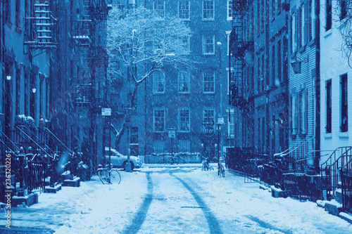 Snowy winter blizzard scene on Gay Street in the Greenwich Village neighborhood of New York City in blue photo
