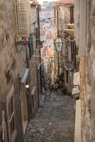 Narrow medieval alley with downstairs view in Dubrovnik in winter, Croatia © Loes Kieboom