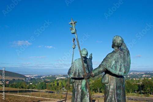 Statues of Pilgrims pointing the cathedral on Monte do Gozo in Santiago de Compostela, Spain photo