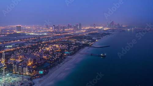 Dubai Marina Skyline night to day from Burj Al Arab. United Arab Emirates timelapse