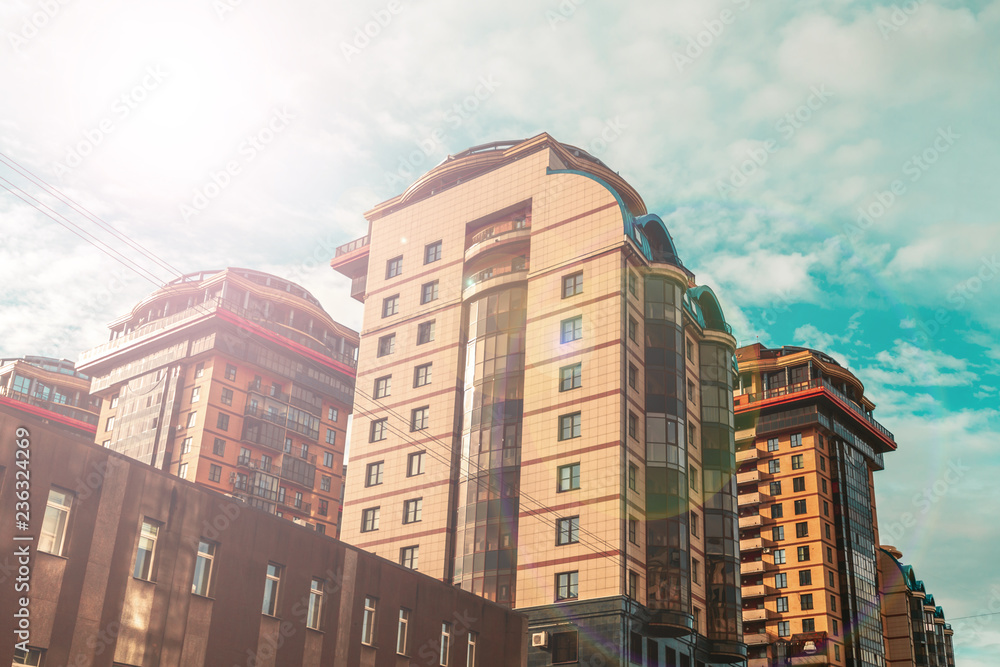 Fototapeta premium group of multi-storey residential buildings in bright light