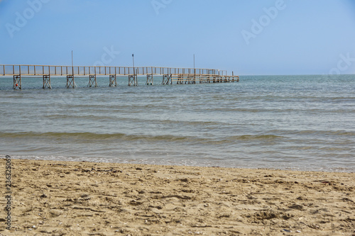 Pier walk by the sea . pedestrian pier in the sea for mooring boats