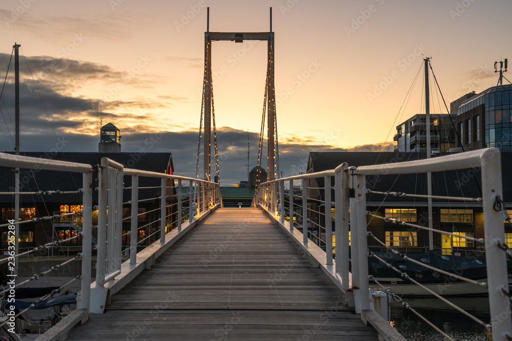 Narrow Modern Suspension Footbridge over a Harbour in Toronto, On, Canada, at Dusk