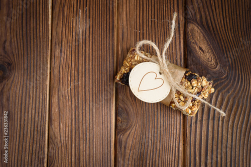 Homemade granola oatmeal energy bars, on wood desk wyth copy space for text