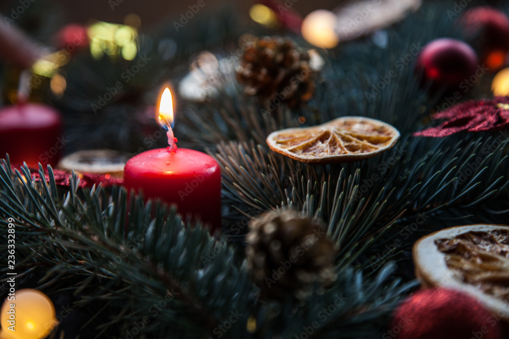 Christmas background with fir and citrus, as well as red candles and decorations Christmas background with fir and citrus, as well as red candles and decorations