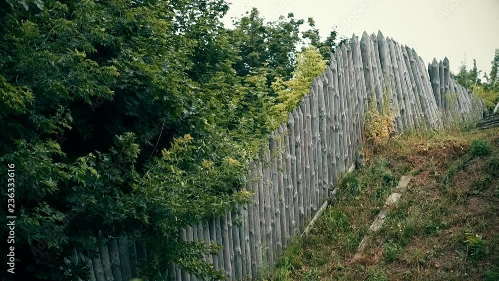 An ancient Slavic pagan city built of wood, excellent scenery for a historical film, old wooden churches and houses, an orthodox cross, summer time, no people in the frame, old Kiev