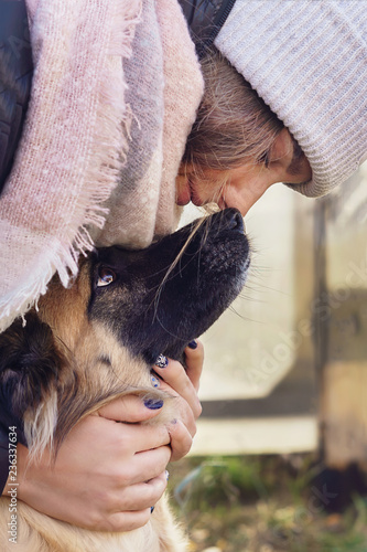 Girl hugging a dog