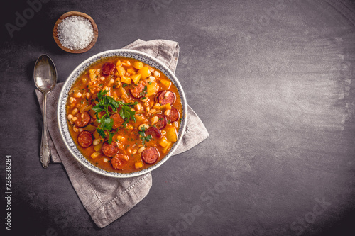 Stew with cabanossi peppers and beans photo