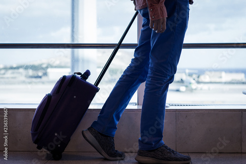 фотографія Man walking with carry on luggage at Las Palmas airport terminal