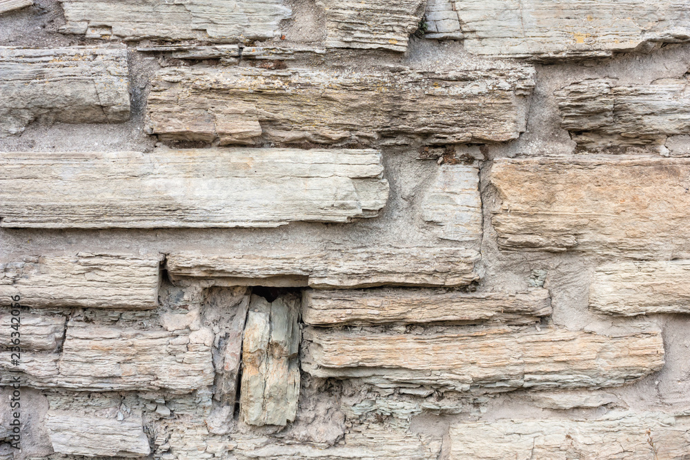 Fototapeta premium Old weathered brick wall of medieval fortress, horizontal grunge background