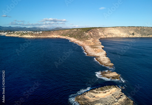 Es Ribell rocky coastline and tranquil Mediterranean Sea. Majorca, Spain