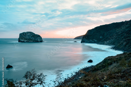 dawning in gaztelugatxe on an autumn day. Beautiful colors, perfect for a postcard. Basque Country, Spain © Iskan