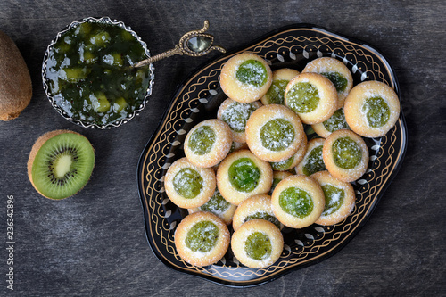 Papier peint Shortbread cookies filled with kiwi jam on a vintage metal tray, kiwi fruit and