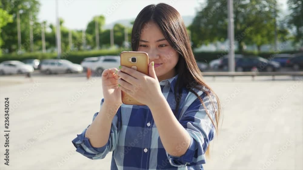 Young Asian Woman Using Digital Smart Phone Tablet Browsing the Web Online Young Asian Woman Using Digital Smart Phone Tablet Browsing the Web Online