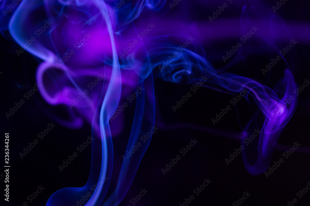 Colorful smoke close-up on a black background Colorful smoke close-up on a black background