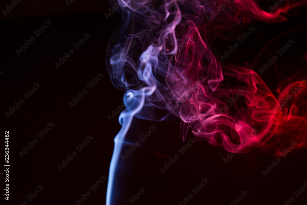 Obraz premium Colorful smoke close-up on a black background